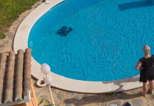 woman upgrade her pool with an automatic pool cleaner