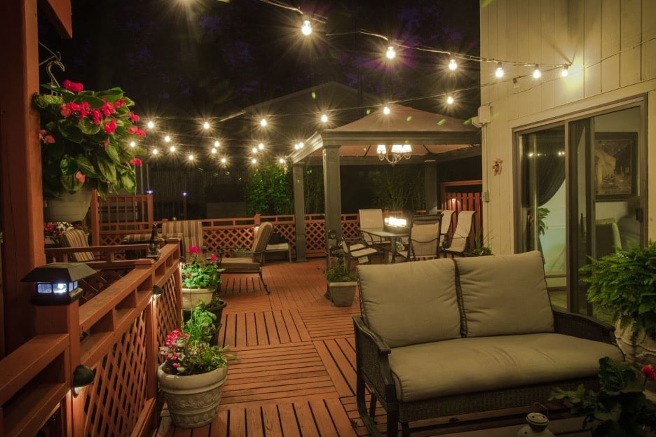 A custom deck with plants and furniture.