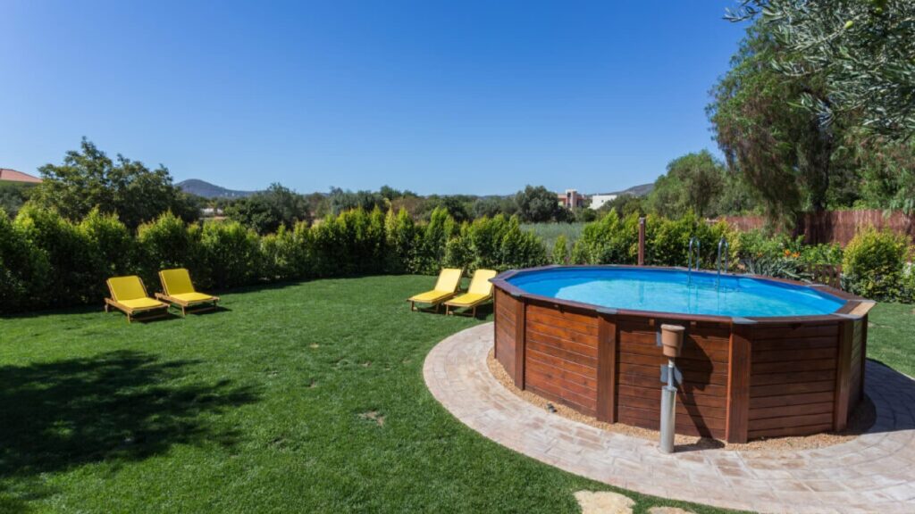 A beautiful backyard with a stunning above-ground pool.