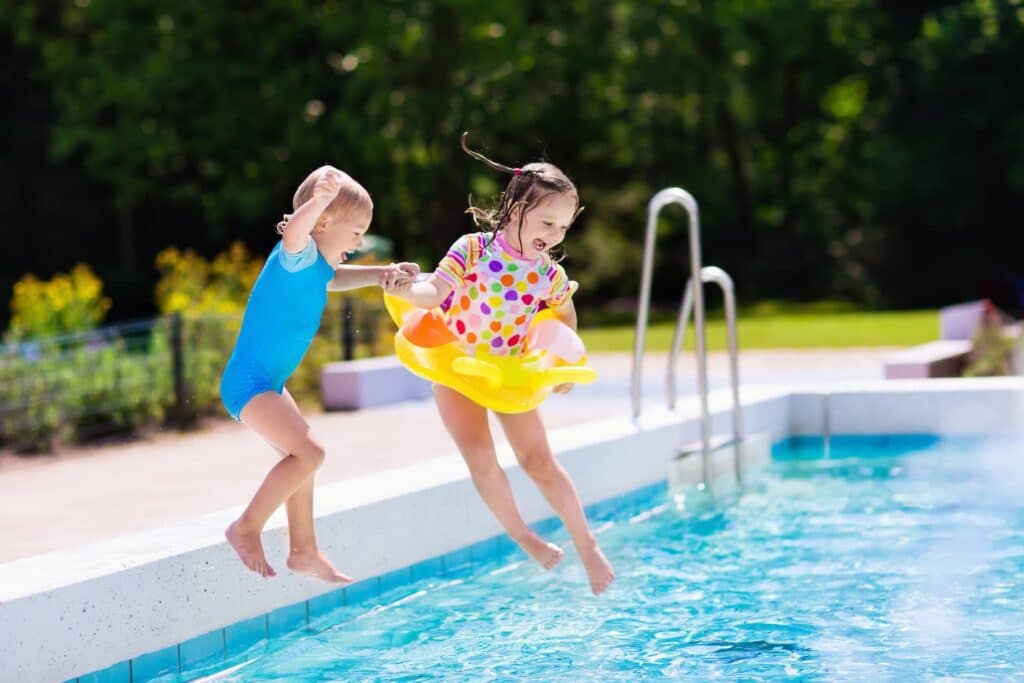 Two children jump into a pool financed by HFS Financial.