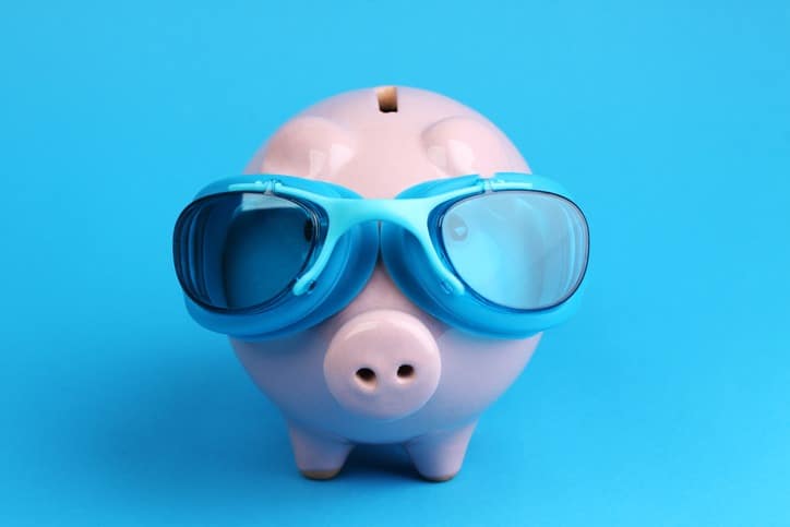 piggy bank wearing blue swimming goggles