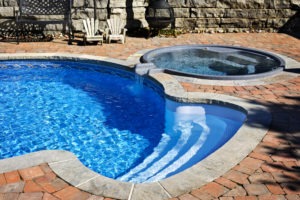 pool renovation with new pool and coping and built in hot tub