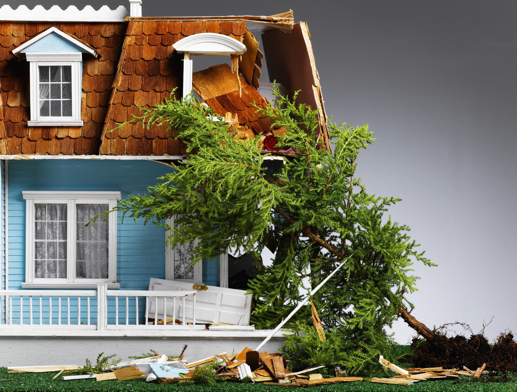 Miniature of house and tree affected by hurricane