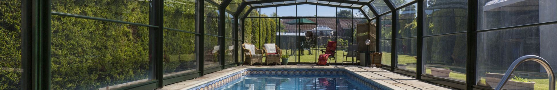 Backyard pool with premium pool enclosure installed