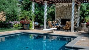 Luxury pool with diving board and fireplace features