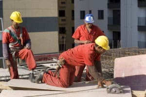 three construction workers working on site
