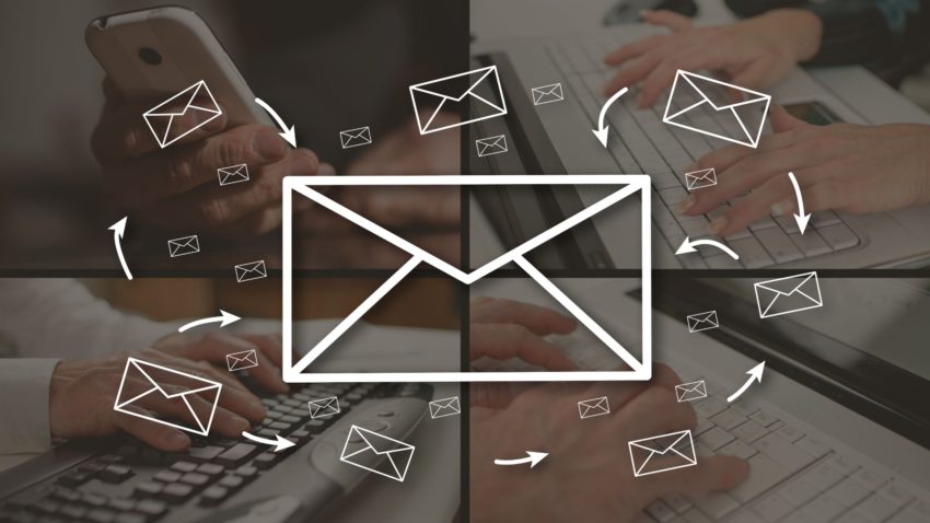 email icons with arrows on top of four people working on how write the best monthly email blast for your contractor business
