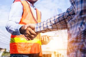 general contractors shaking hands with client