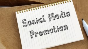 Notebook that says "Social Media Promotion"