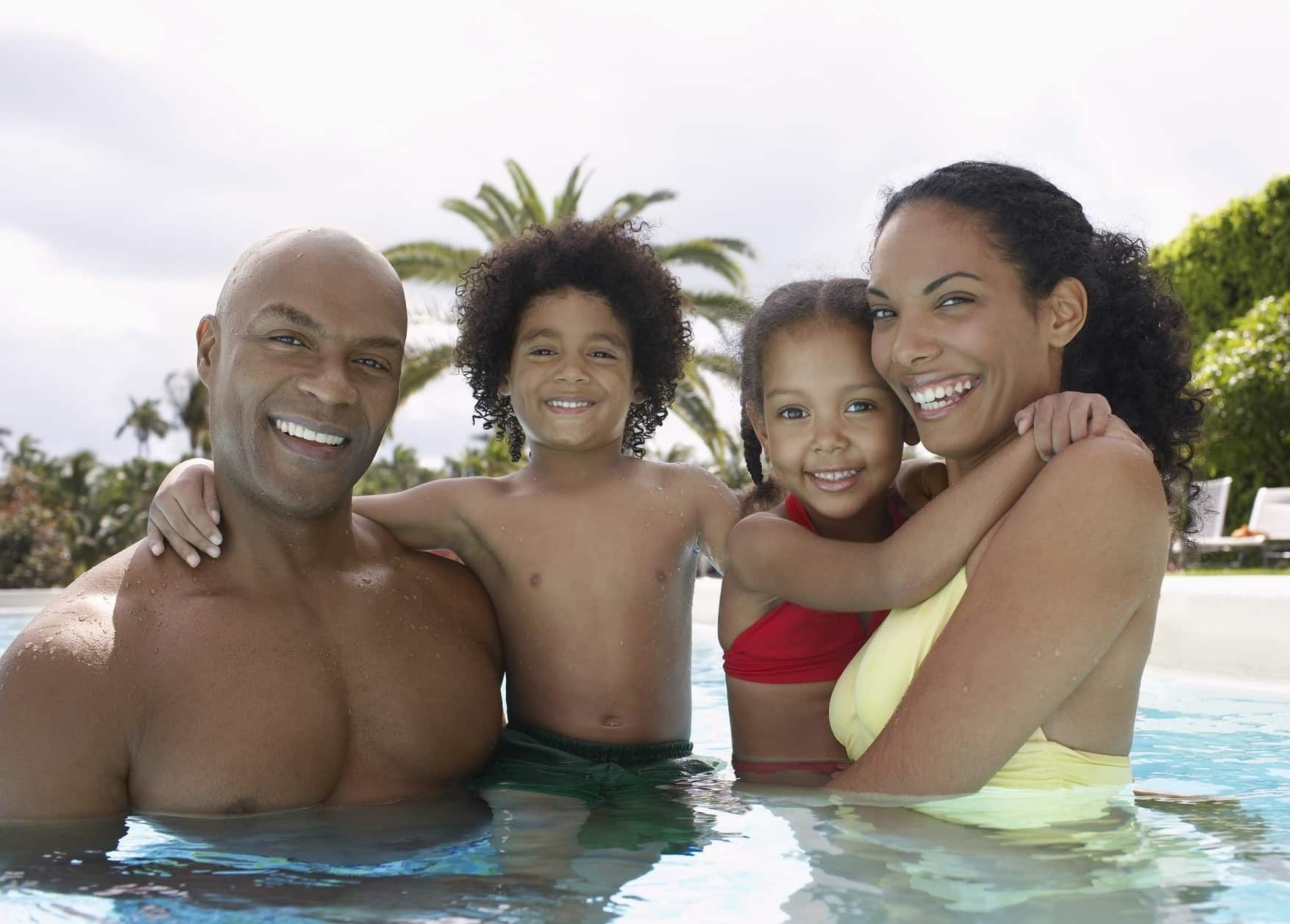 Family enjoying inground swimming pool