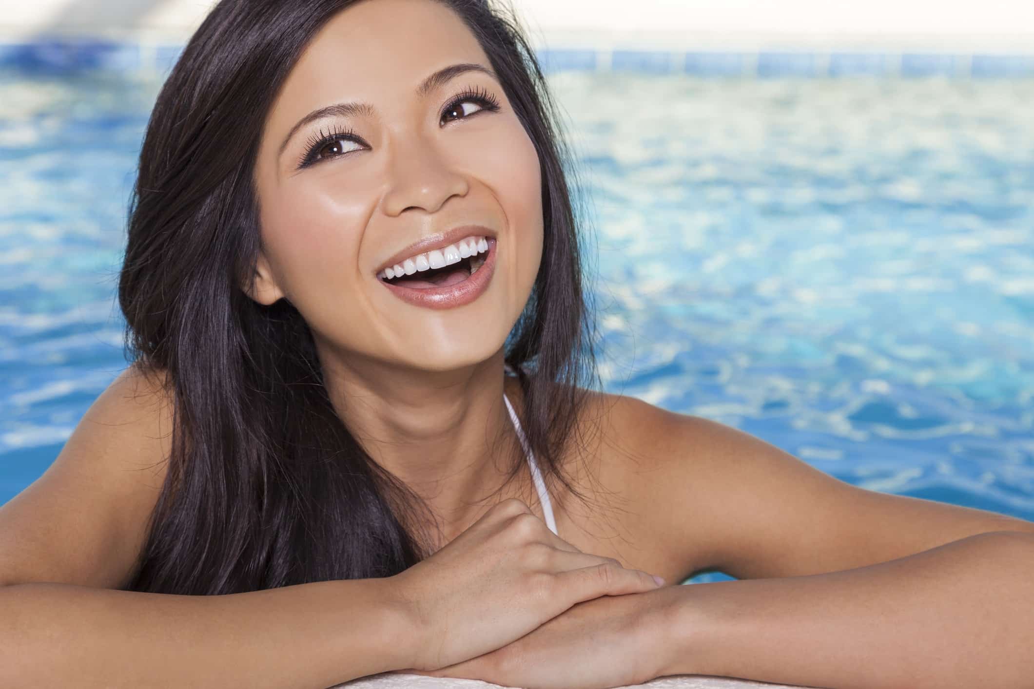 Woman in swimming pool smiling