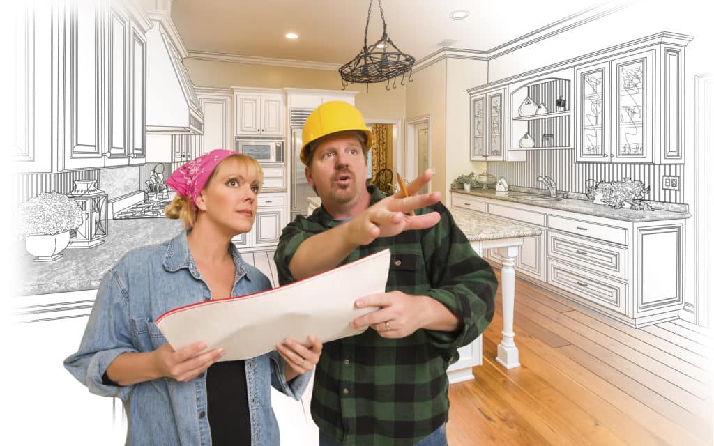 general contractor explains blueprints to client