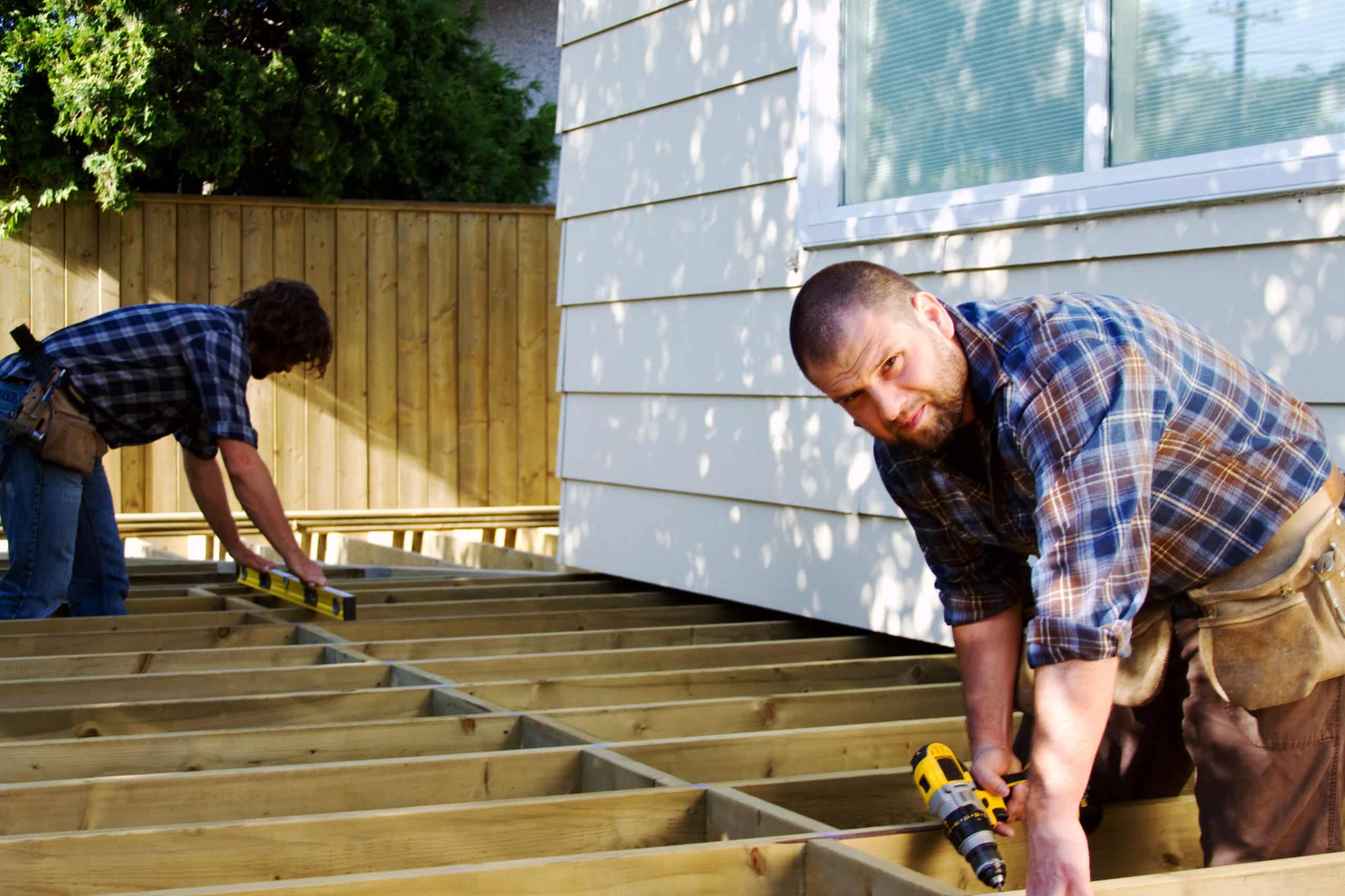 Two contractors build a deck which is a good example of what every deck and patio business needs in a website.