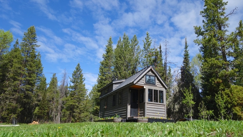 A tiny home sits on the existing property of a home owner who has searched for financing options for ADUs.