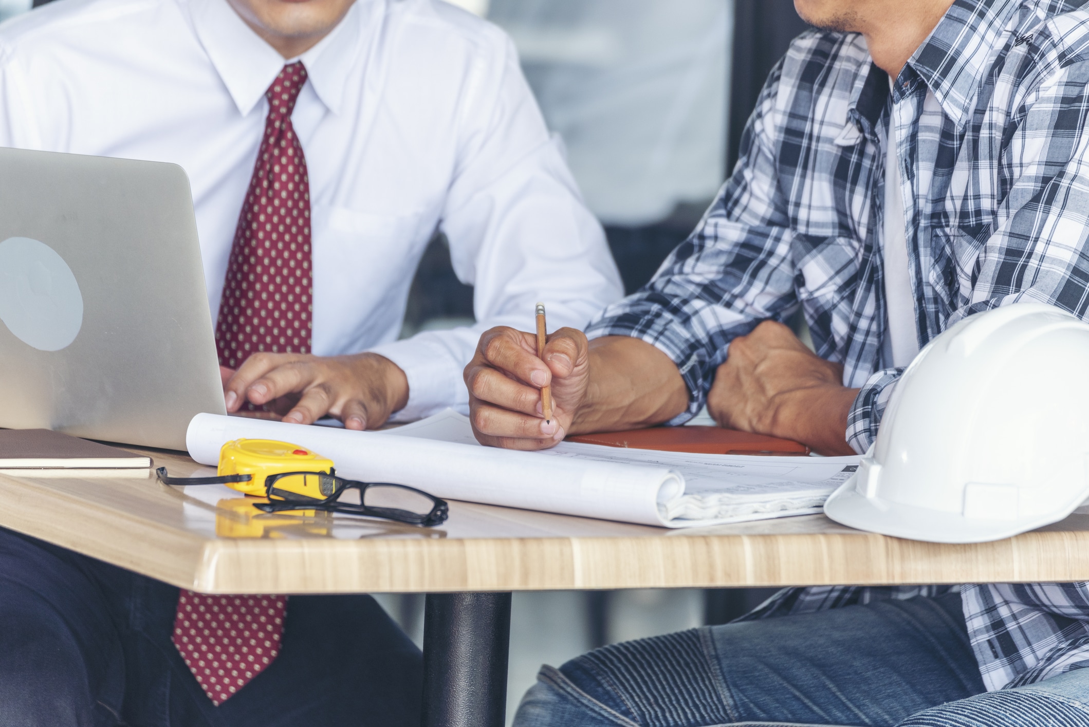 A contractor meets with a client to discuss financing for contractors