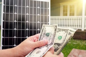 A homeowner with savings from their solar loans for their solar panels