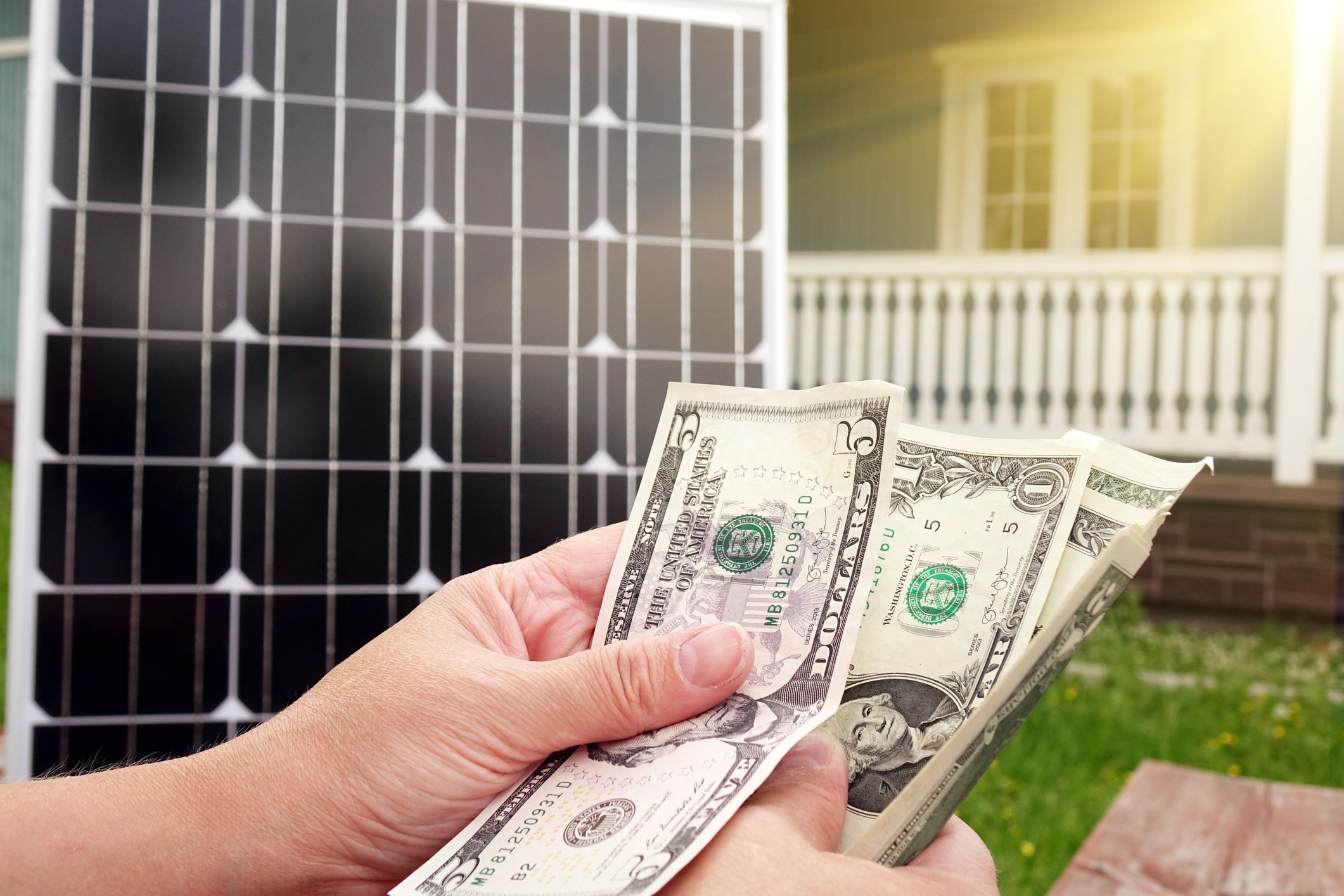 A homeowner with savings from their solar loans for their solar panels